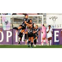 Racing Louisville FC mobs Savannah DeMelo after her free kick goal against the San Diego Wave