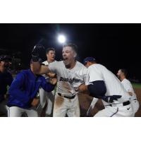 Troy Johnston and the Pensacola Blue Wahoos celebrate a walk-off win