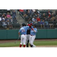 The Tri-City Dust Devils, playing as the Columbia River Rooster Tails, celebrate after a homer