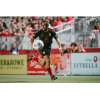 Phoenix Rising FC eyes the ball against El Paso Locomotive FC