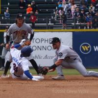 New York Boulders' Jake MacKeznie slides in safely