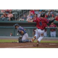 Pete Kozma of the Kansas City Monarchs slides into home