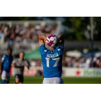 Miguel Acosta of Atlético Ottawa prepares a throw-in