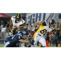 Hamilton Tiger-Cats battle the Toronto Argonauts