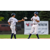 Hitting Coach Tyler Caserta congratulates Andrew Sojka of the Fond du Lac Dock Spiders