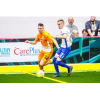 Breno Oliveria of the Florida Tropics (left)