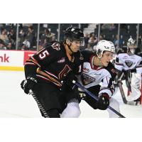 Vancouver Giants centre Jaden Lipinski (right) vs. the Calgary Hitmen