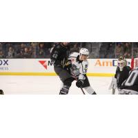 Ontario Reign's Alex Turcotte Battles Henderson Silver Knights' Daniil Miromanov