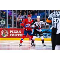 Spokane Chiefs' Ty Cheveldayoff and Vancouver Giants' Ty Thorpe on the ice