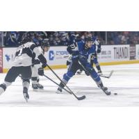 Saint John Sea Dogs' Connor Trenholm and Blainville-Boisbriand Armada's Zach Biggar in action