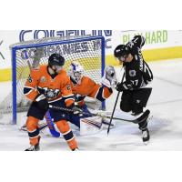 Worcester Railers goaltender Ken Appleby makes a stop while defenseman Jared Brandt stands ready