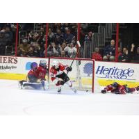 Cincinnati Cyclones' Lincoln Griffin battles Kalamazoo Wings' Evan Cormier