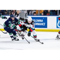 Seattle Thunderbirds' Kyle Crnkovic battles Kelowna Rockets' Grady Lenton