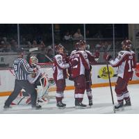 Peterborough Petes' Connor Lockhart, Tucker Robertson and Donovan McCoy celebrate win