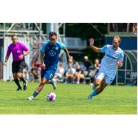 Halifax Wanderers midfielder Aidan Daniels (left)