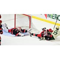 Grand Rapids Griffins goaltender Victor Brattstrom sprawls for a save against the Iowa Wild