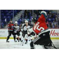 Kelowna Rockets' John Babcock and Vancouver Giants' Colton Roberts on game night