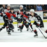 Kelowna Rockets' Max Graham and Dylan Wightman versus Vancouver Giants' Matthew Edwards