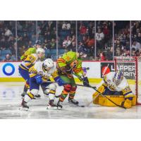 Saskatoon Blades' Trevor Wong and Ethan Chadwick battle Kamloops Blazers' Conner Radke