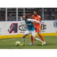 St. Louis Ambush's Brian Bement and Florida Tropics' Drew Ruggles on the field