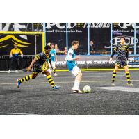 Milwaukee Wave's Qudus Lawal and St. Louis Ambush's Zachary Druhe in action