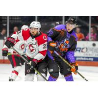 Cincinnati Cyclones' Louie Caporusso battles Fort Wayne Komets' Mark Rassell