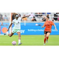 Racing Louisville FC's Jess McDonald and Houston Dash's Marisa Viggiano on game day