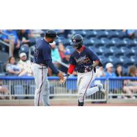 Mississippi Braves' coach Kanekoa Texeira congratulates Javier Valdes