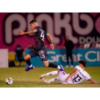 Las Vegas Lights FC's Emmanuel Ledesma battles Charleston Battery's Nick Markanich