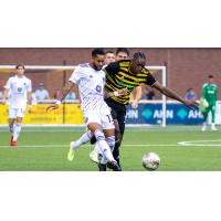 Louisville City FC defender Amadou Dia (left) vs. Pittsburgh Riverhounds SC