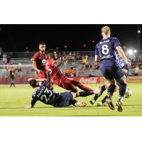 Phoenix Rising FC's Henry Uzochukwu and Tampa Bay Rowdies' Younes Boudadi and Jack Blake in action