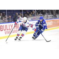 Syracuse Crunch forward Dylan Duke (right) vs. the Rochester Americans