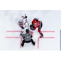 Kayden Longley of the Kelowna Rockets (right) in the faceoff circle