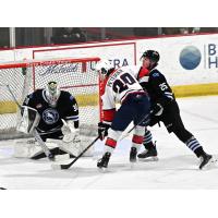 Wenatchee Wild's Alex Garrett and Lukas McCloskey versus Lethbridge Hurricanes' Chase Petersen