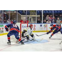 Saginaw Spirit right wing Igor Chernyshov (right) takes a shot against the Kingston Frontenacs